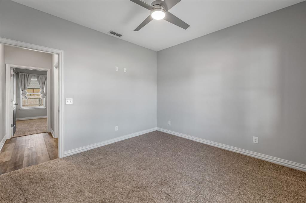 1501 Johnson Road, Unit A Iowa Park, TX 76367 - Photo 24 of 30 an empty room with fan and entrance