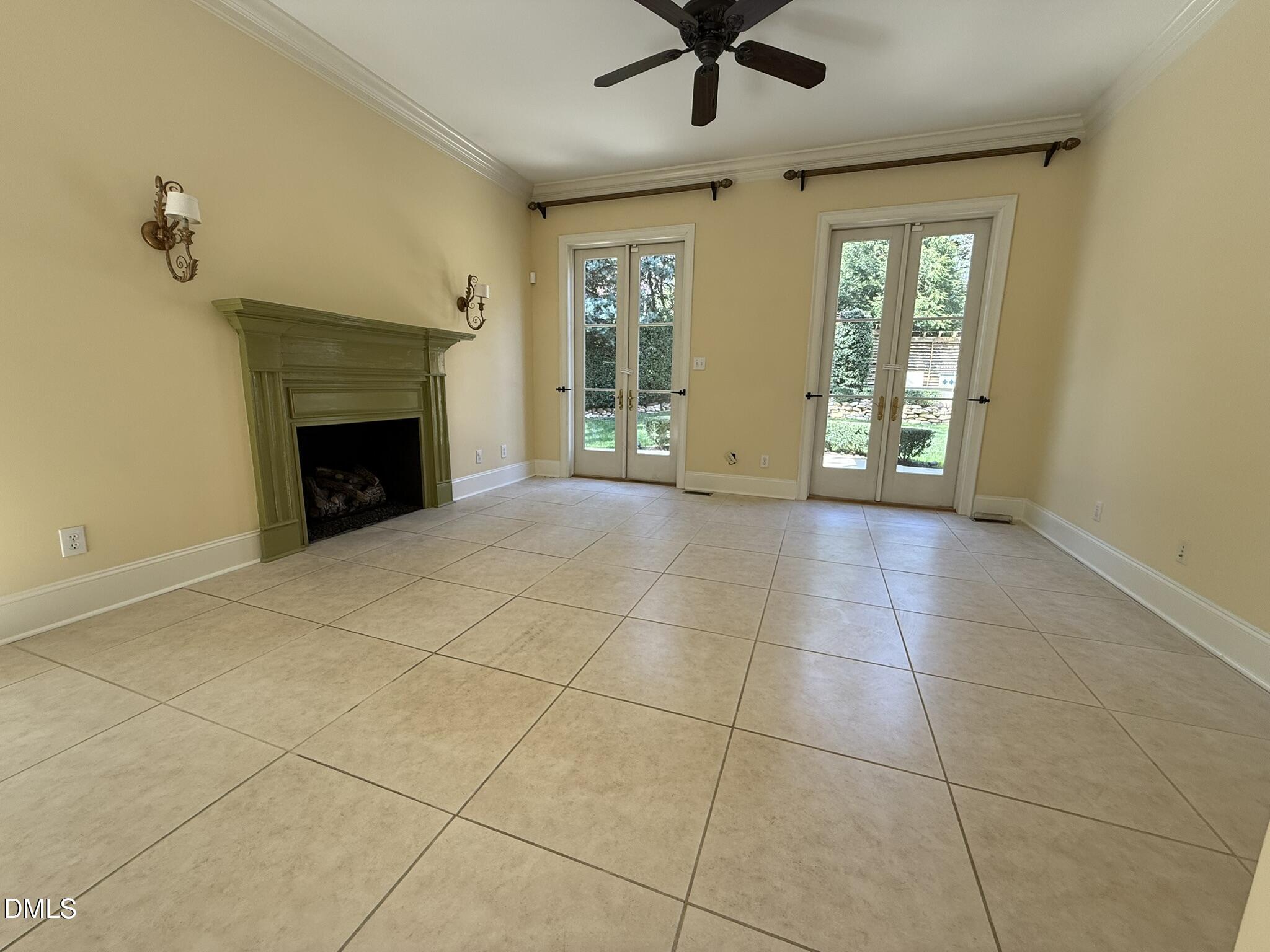 3617 Carlow Court Raleigh, NC 27612 - Photo 11 of 30 a view of an empty room with a fireplace and a window