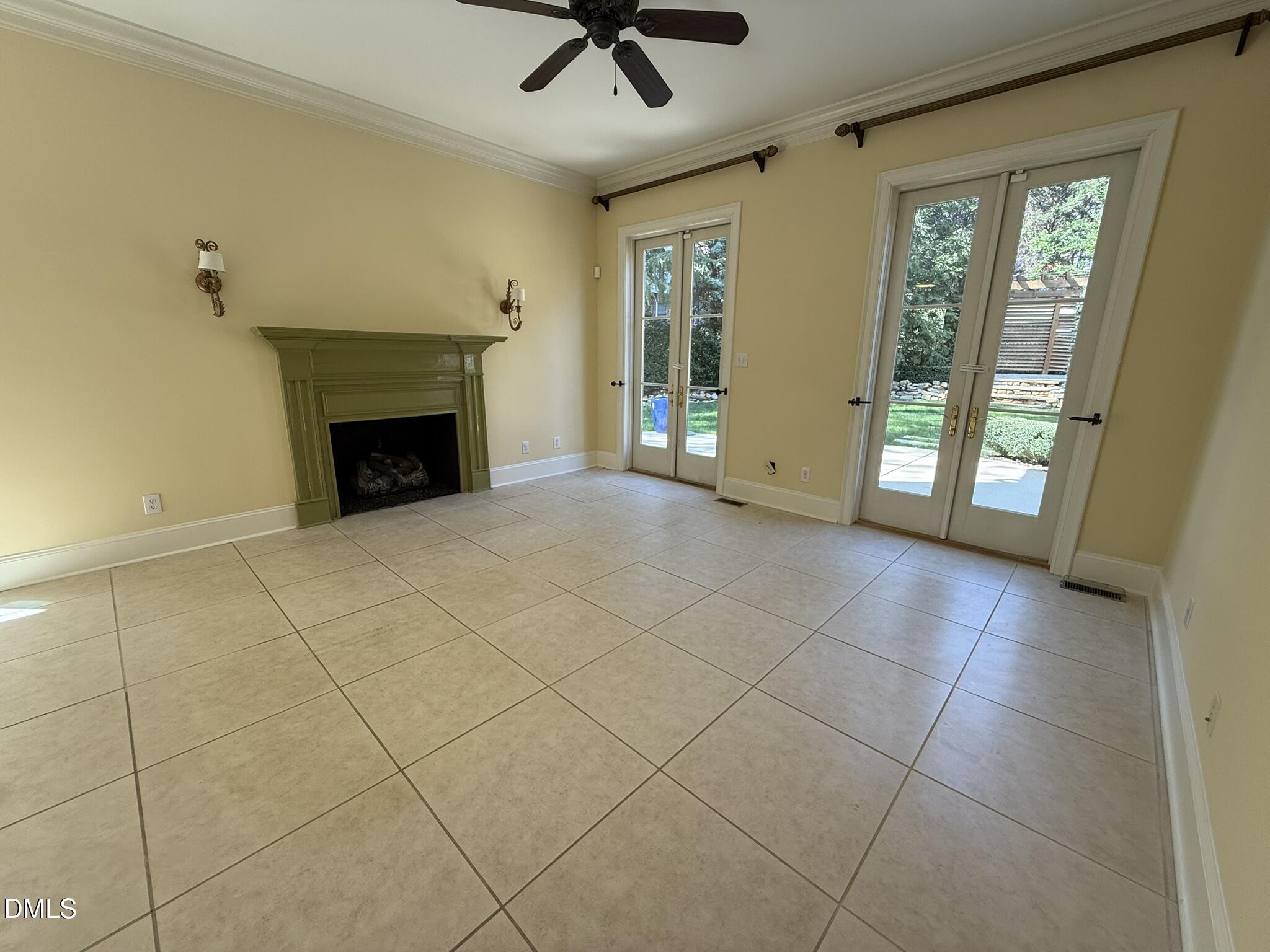 3617 Carlow Court Raleigh, NC 27612 - Photo 12 of 30 a view of an empty room with a fireplace and a window