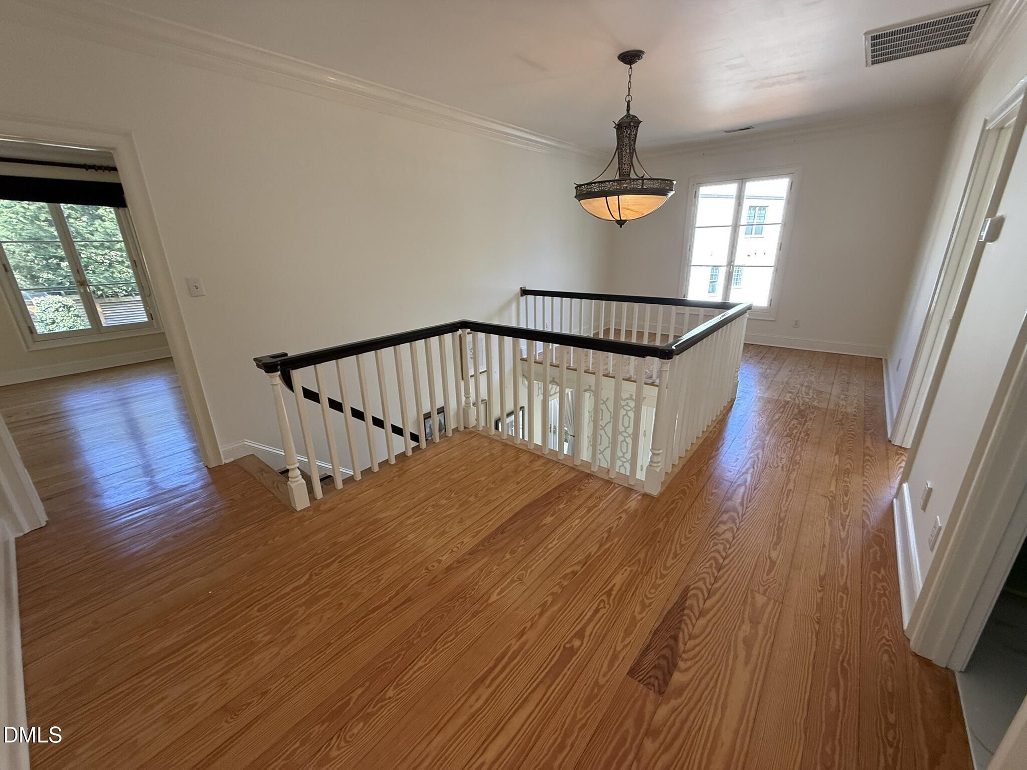 3617 Carlow Court Raleigh, NC 27612 - Photo 14 of 30 a view of entryway and hall with wooden floor