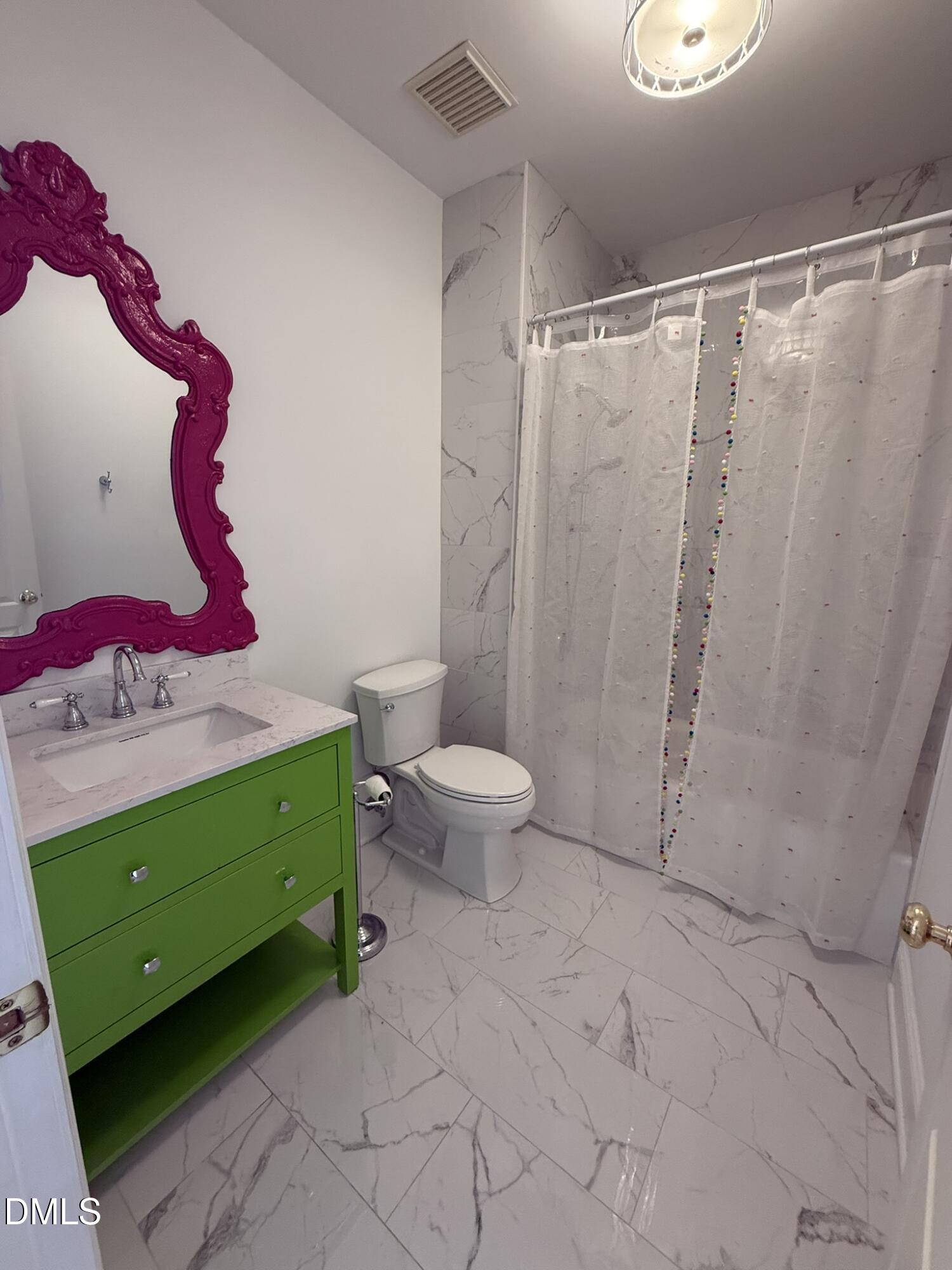 3617 Carlow Court Raleigh, NC 27612 - Photo 21 of 30 a bathroom with a sink and toilet