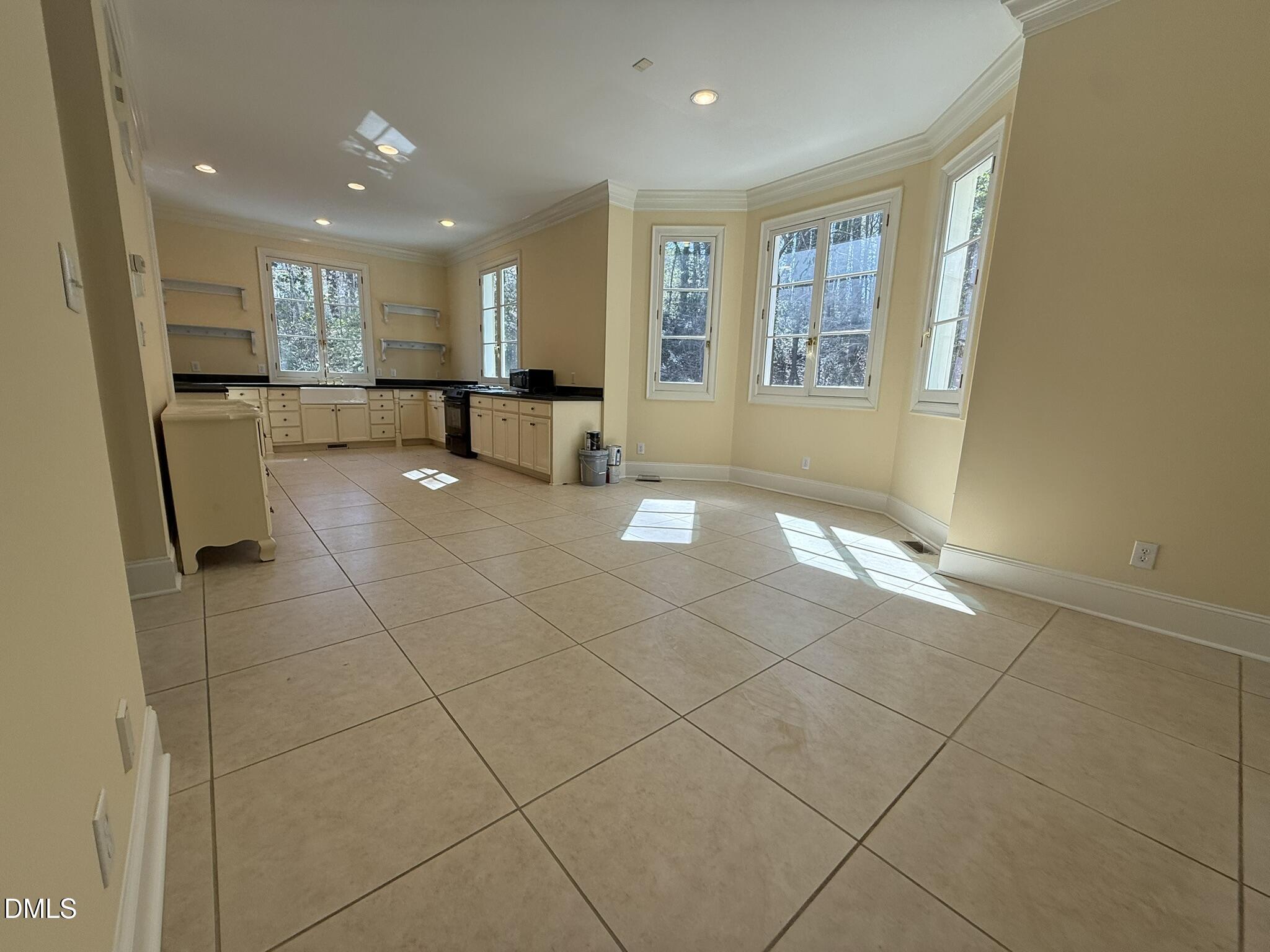 3617 Carlow Court Raleigh, NC 27612 - Photo 5 of 30 a view of a kitchen with furniture and a refrigerator