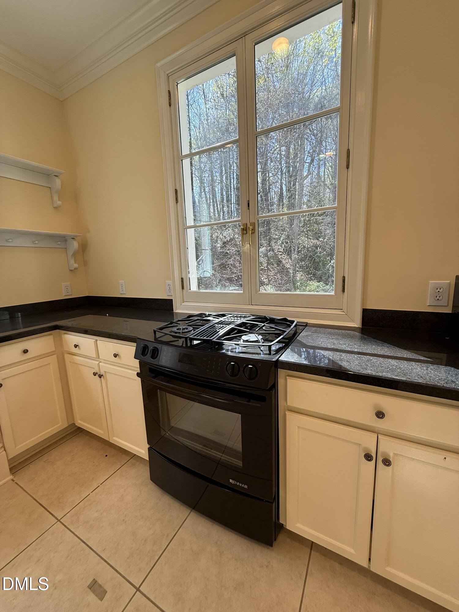 3617 Carlow Court Raleigh, NC 27612 - Photo 9 of 30 a stove top oven sitting inside of a kitchen
