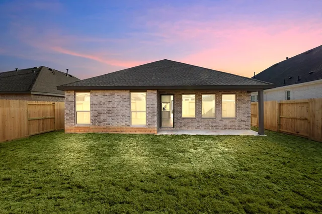 a view of a backyard of the house