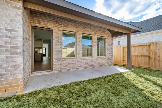 a view of front door of house with yard
