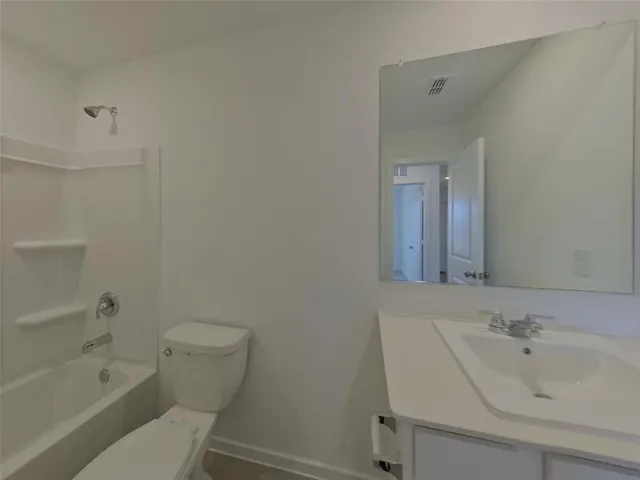a bathroom with a sink toilet and bathtub