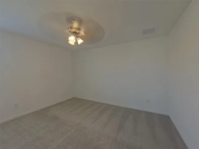 a backyard of a house with lots of green space and outdoor seating