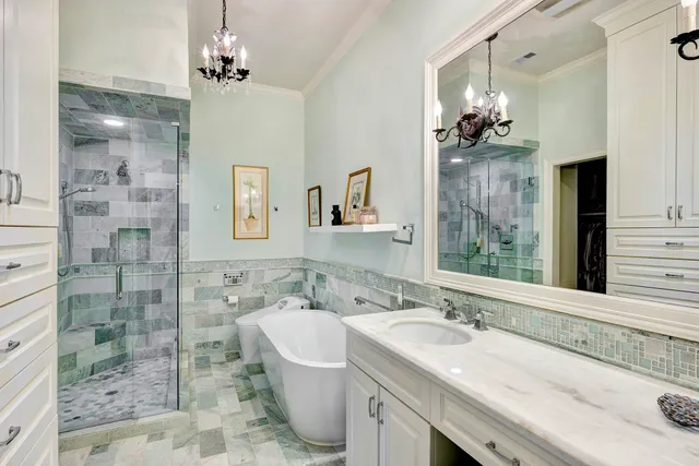 a spacious bathroom with a sink a large mirror and a shower