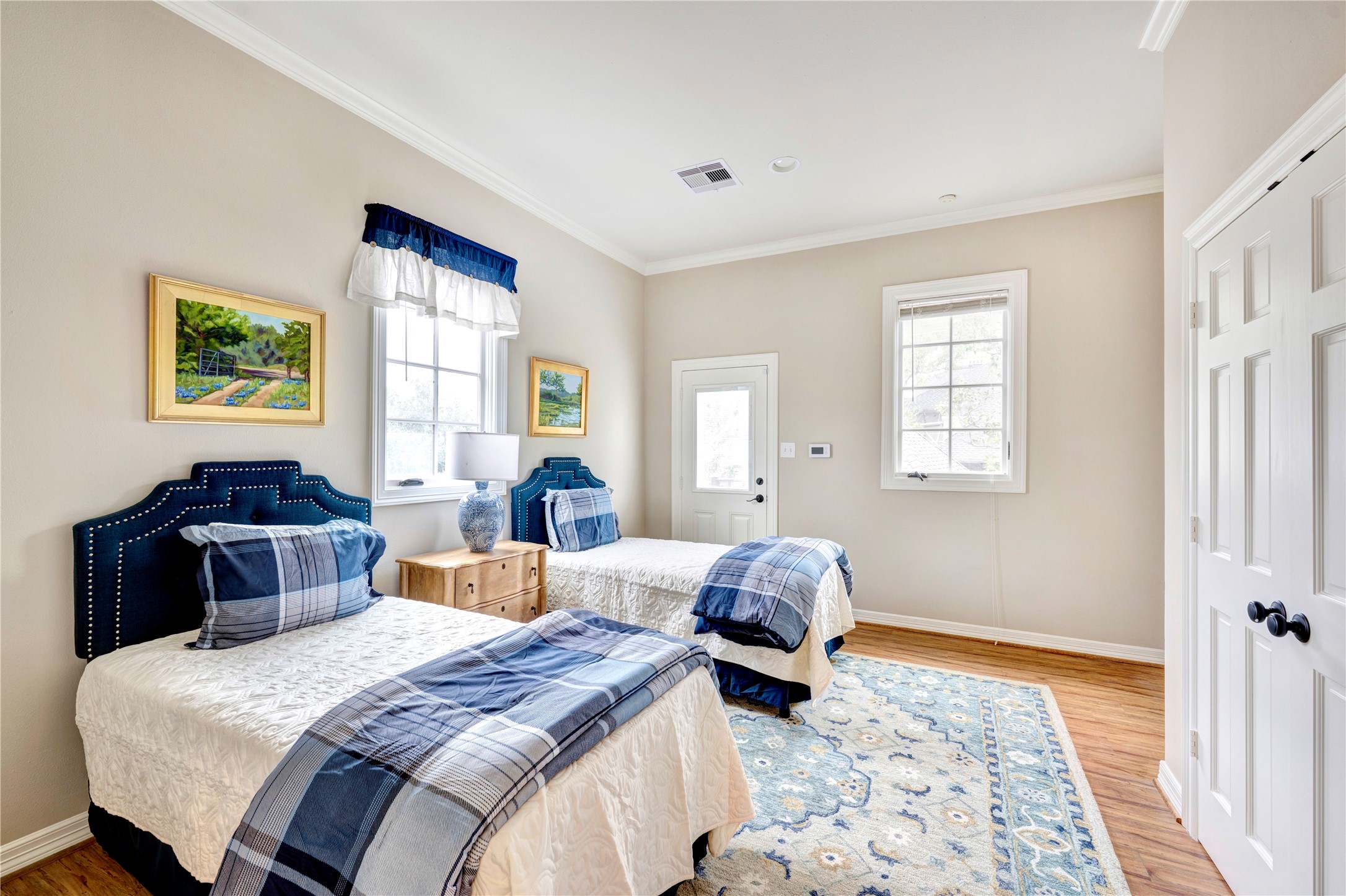 3744 Inwood Drive Houston, TX 77019 - Photo 25 of 32 a bedroom with a bed and wooden floor