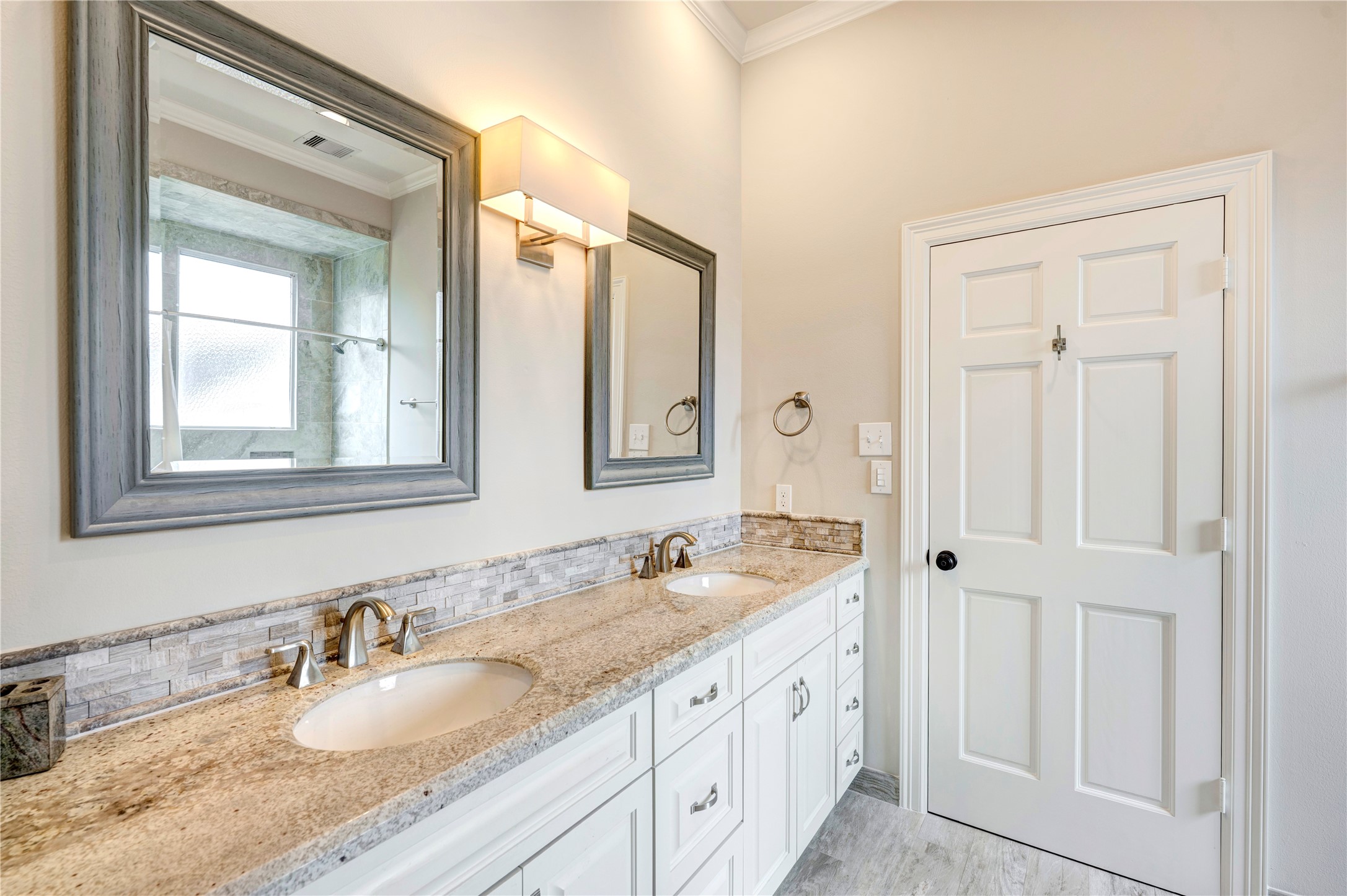 3744 Inwood Drive Houston, TX 77019 - Photo 26 of 32 a bathroom with double sink and a mirror