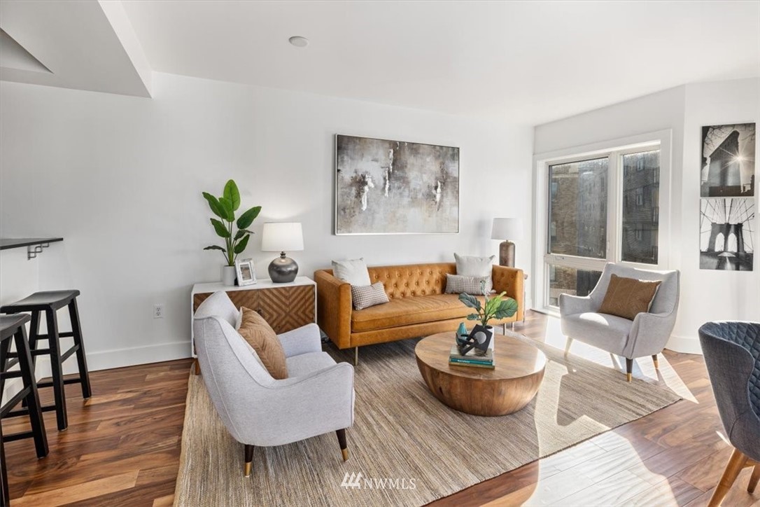 159 Denny Way, Unit 313 Seattle, WA 98109 - Photo 11 of 32 a living room with furniture and a potted plant