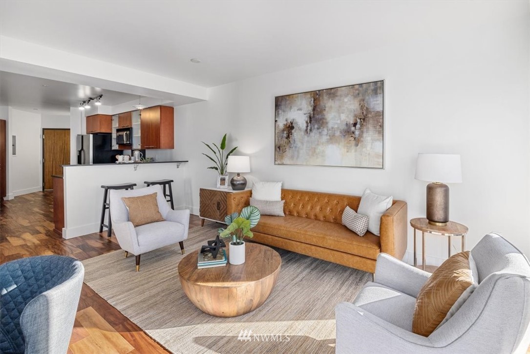 159 Denny Way, Unit 313 Seattle, WA 98109 - Photo 12 of 32 a living room with furniture and wooden floor