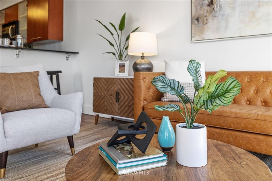 159 Denny Way, Unit 313 Seattle, WA 98109 - Photo 22 of 32 a living room with furniture and a potted plant