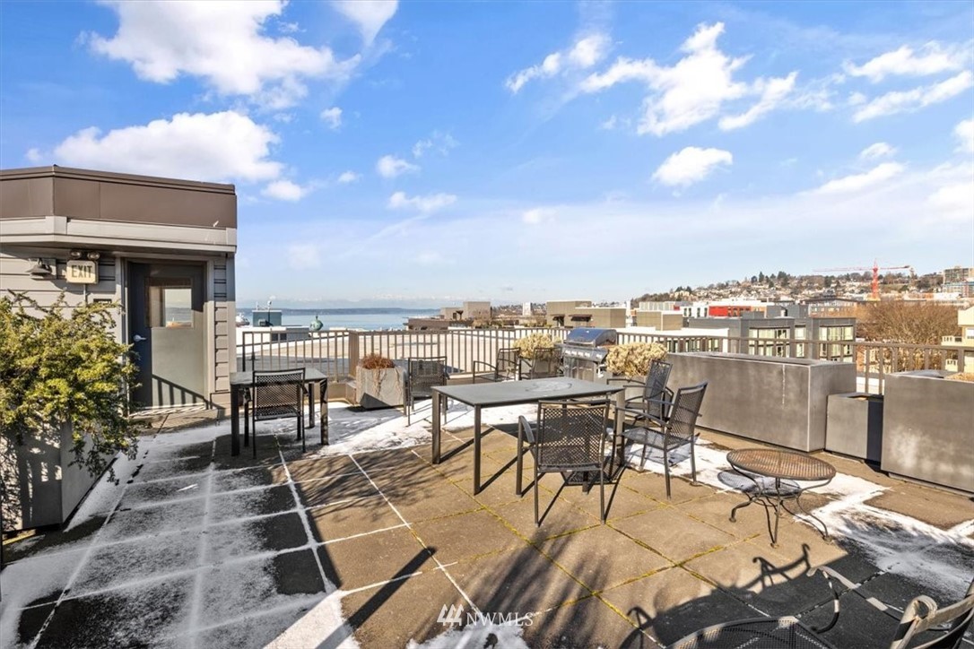 159 Denny Way, Unit 313 Seattle, WA 98109 - Photo 23 of 32 a view of a terrace with seating area