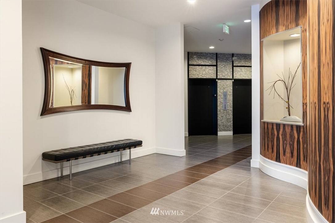 159 Denny Way, Unit 313 Seattle, WA 98109 - Photo 27 of 32 a view of a hallway with seating area