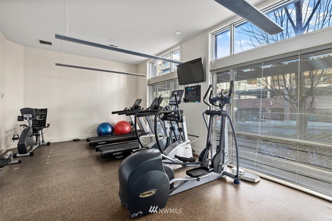 159 Denny Way, Unit 313 Seattle, WA 98109 - Photo 30 of 32 a view of a room with gym equipment