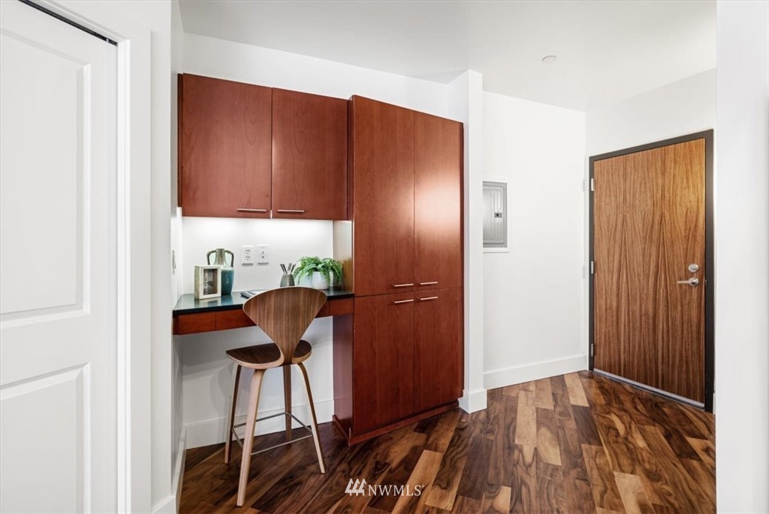 159 Denny Way, Unit 313 Seattle, WA 98109 - Photo 3 of 32 a view of a livingroom with furniture and wooden floor