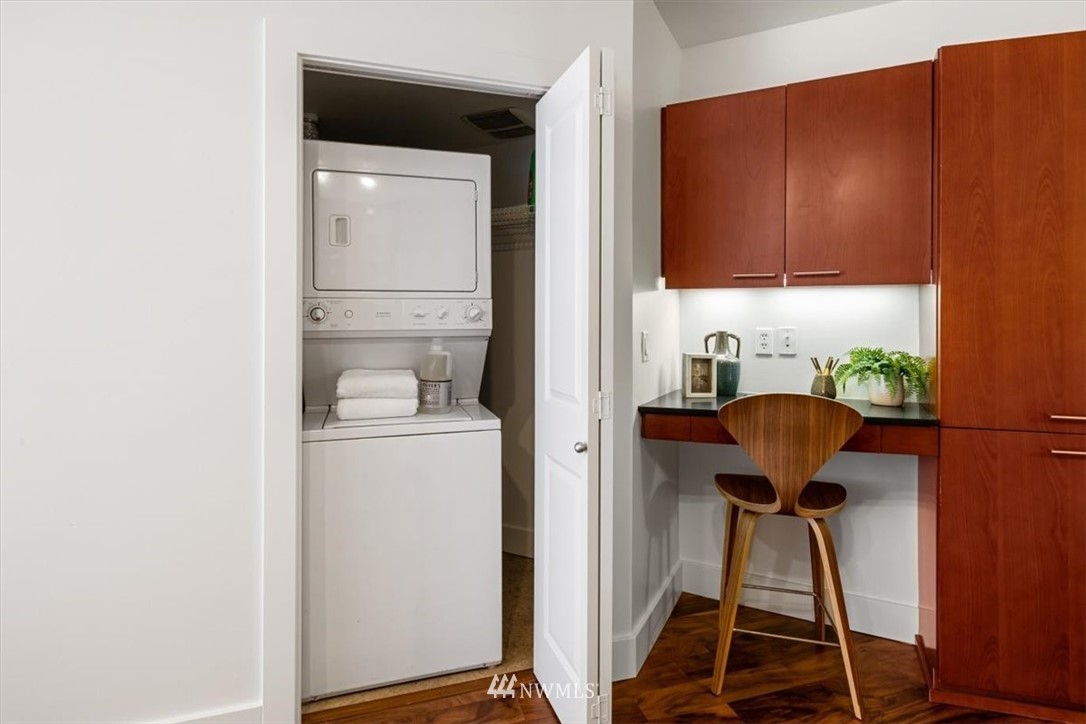 159 Denny Way, Unit 313 Seattle, WA 98109 - Photo 4 of 32 a view of storage and utility room with washer and dryer