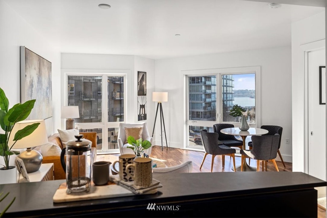 159 Denny Way, Unit 313 Seattle, WA 98109 - Photo 5 of 32 a view of a dining room with furniture window and outside view