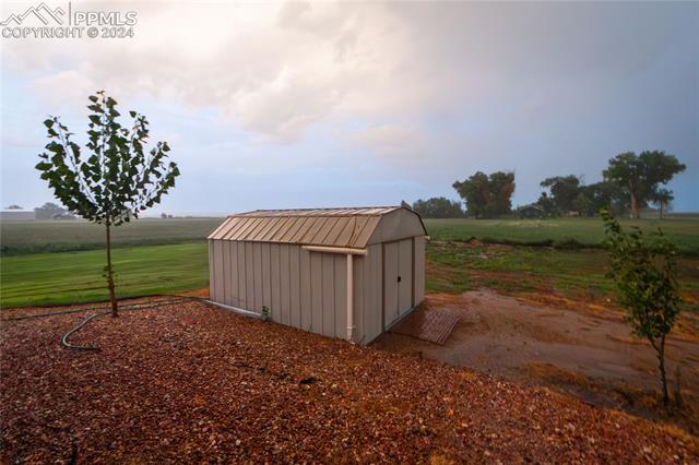 1027 County Road LL Fowler, CO 81039 - Photo 36 of 37 View of outbuilding with a rural view