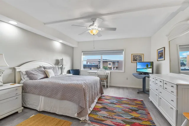 a bedroom with a bed and a view of bedroom