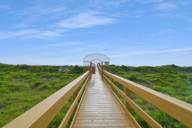 a view of a balcony with an outdoor seating