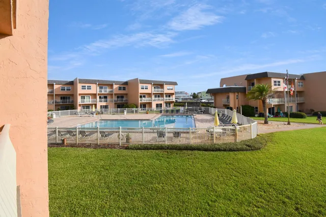 a view of a building with a yard