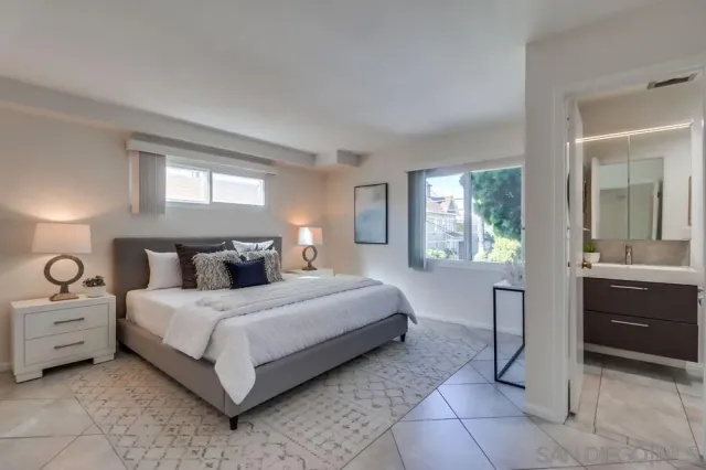 a bedroom with a bed and a dresser