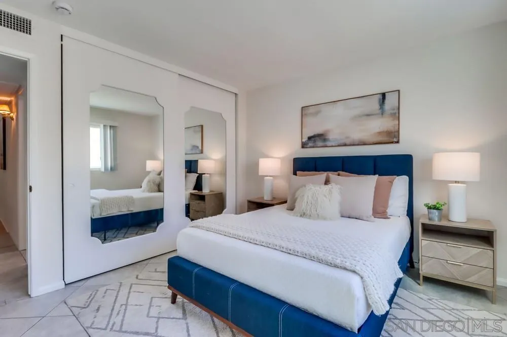 2244 2nd Avenue, Unit 25 San Diego, CA 92101 - Photo 16 of 27 a bedroom with a bed and a view of living room