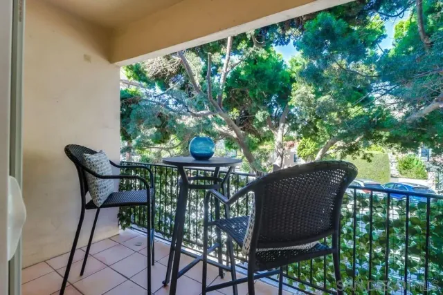 a patio with table and chairs