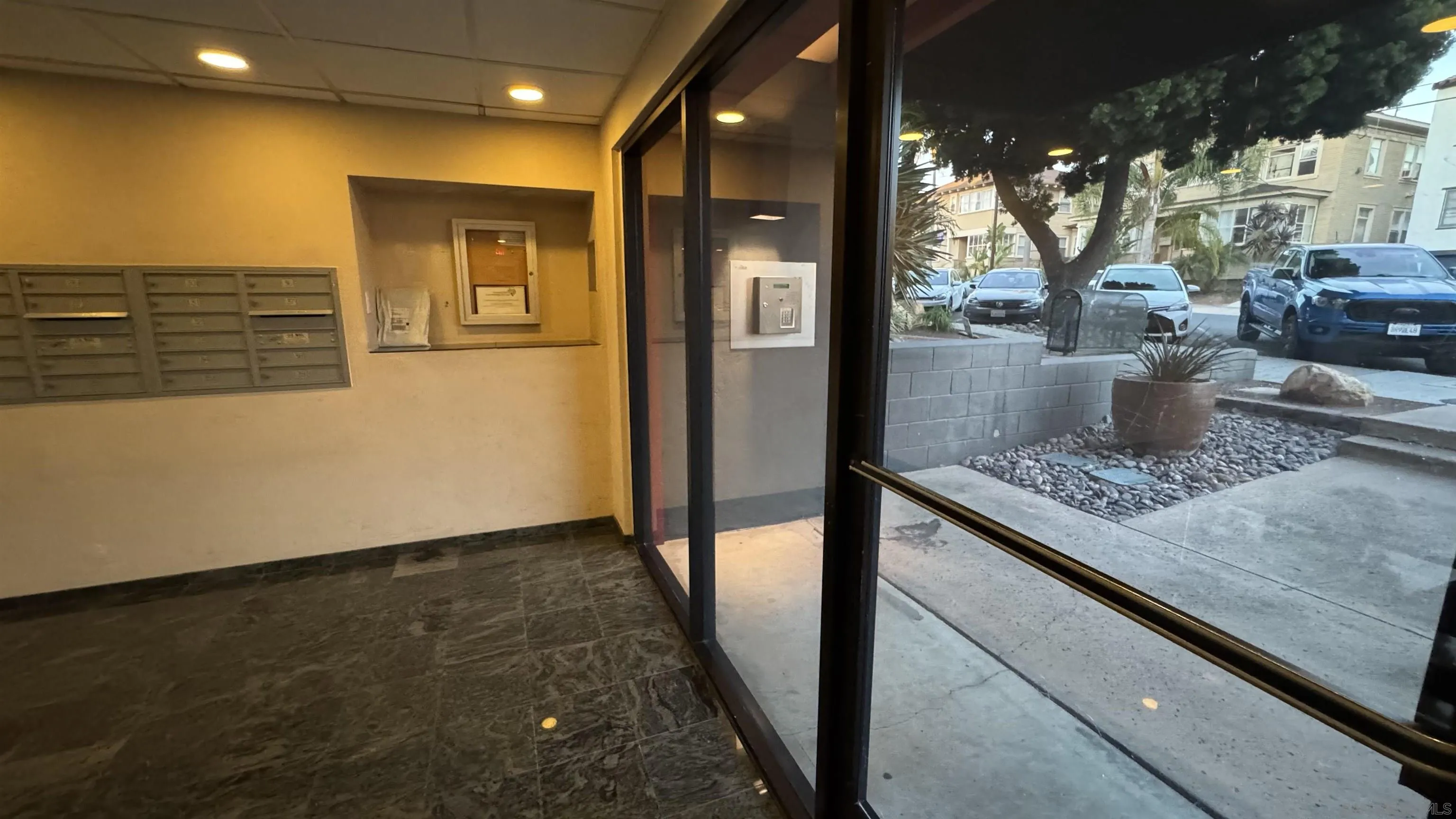 2244 2nd Avenue, Unit 25 San Diego, CA 92101 - Photo 23 of 27 a kitchen with stainless steel appliances granite countertop a stove a sink and a refrigerator