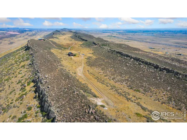 a view of an ocean beach and mountain