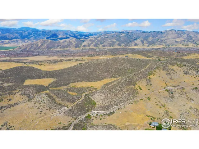 a view of an ocean beach and mountain