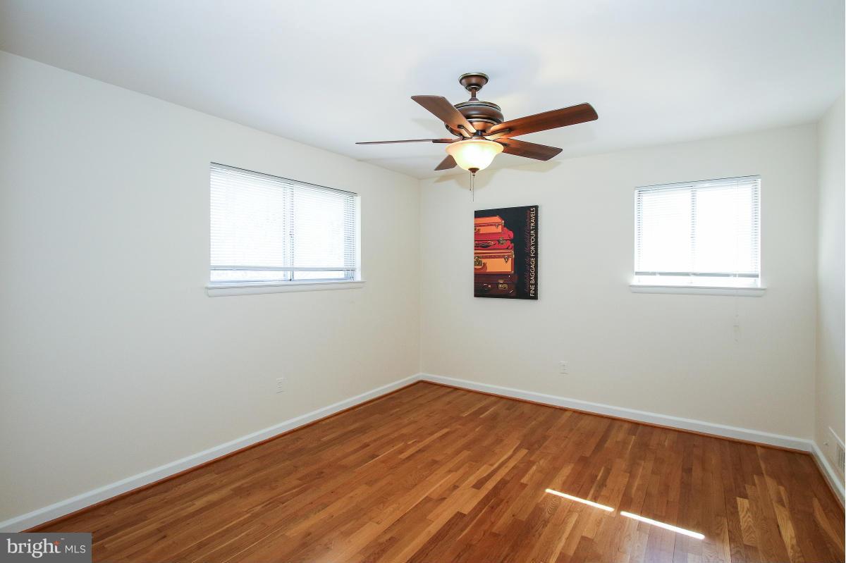 7708 Beech Tree Road Bethesda, MD 20817 - Photo 14 of 30 a view of empty room with wooden floor