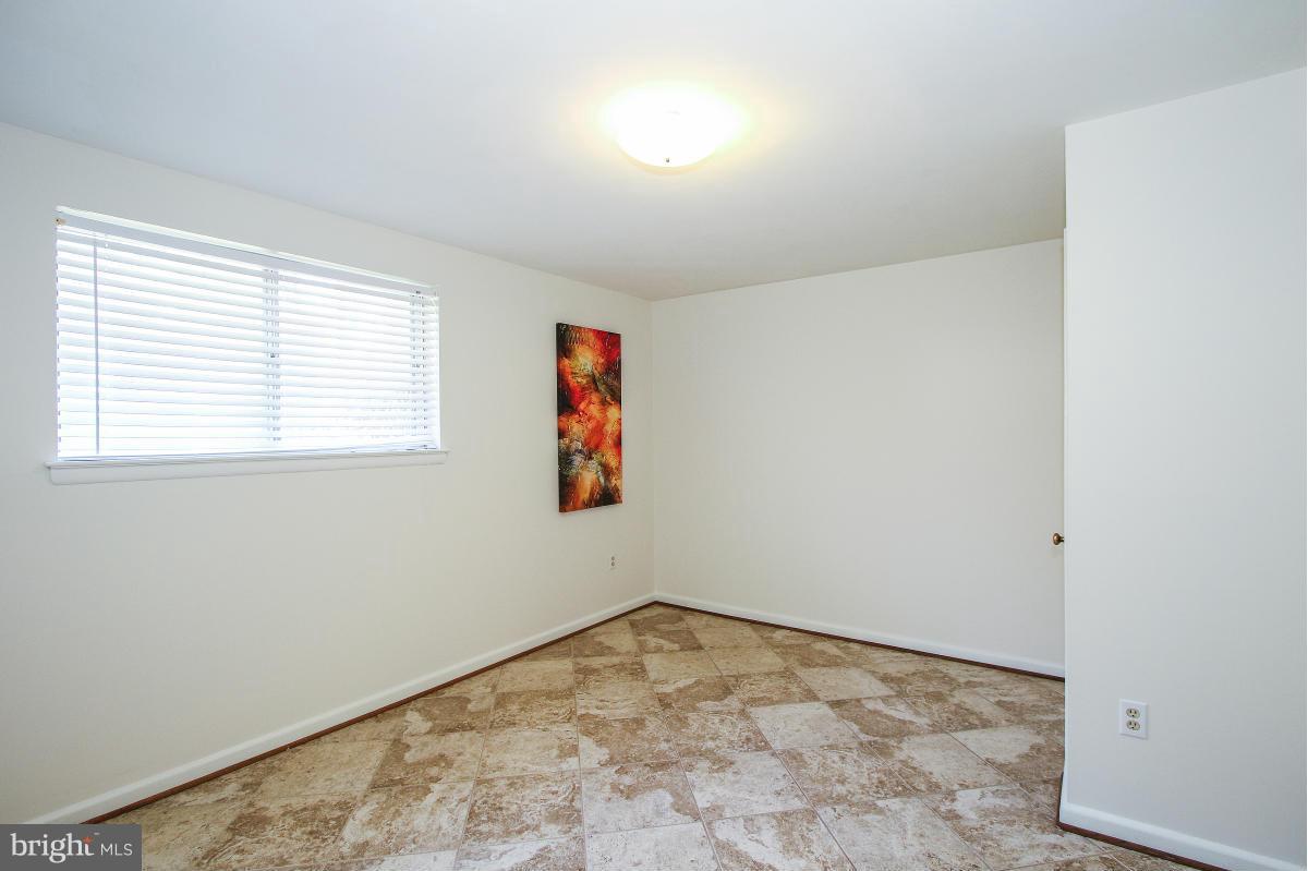 7708 Beech Tree Road Bethesda, MD 20817 - Photo 20 of 30 an empty room with a window