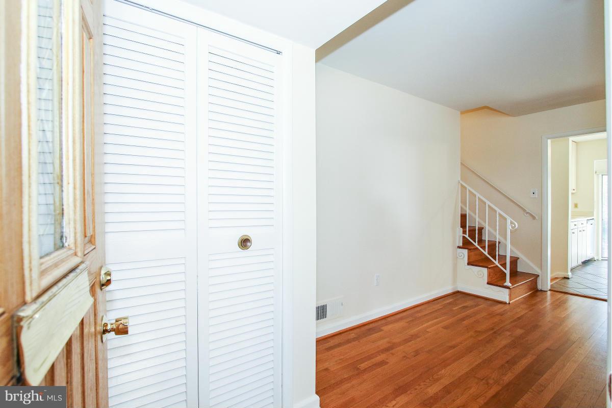 7708 Beech Tree Road Bethesda, MD 20817 - Photo 3 of 30 a view of a hallway with wooden floor and a window