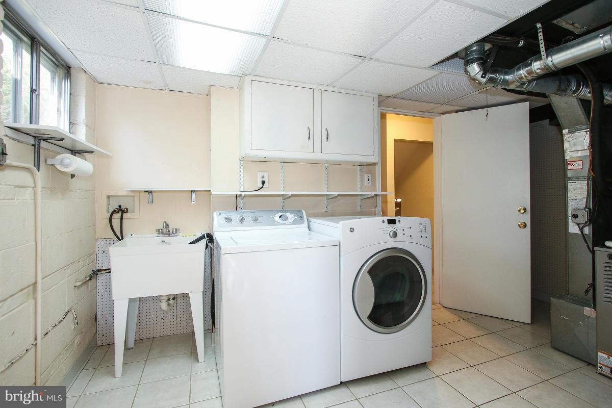 7708 Beech Tree Road Bethesda, MD 20817 - Photo 25 of 30 a utility room with dryer and washer