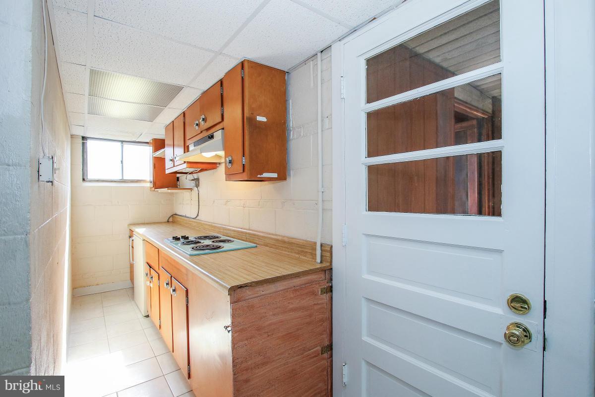 7708 Beech Tree Road Bethesda, MD 20817 - Photo 26 of 30 a kitchen with a stove and a cabinets