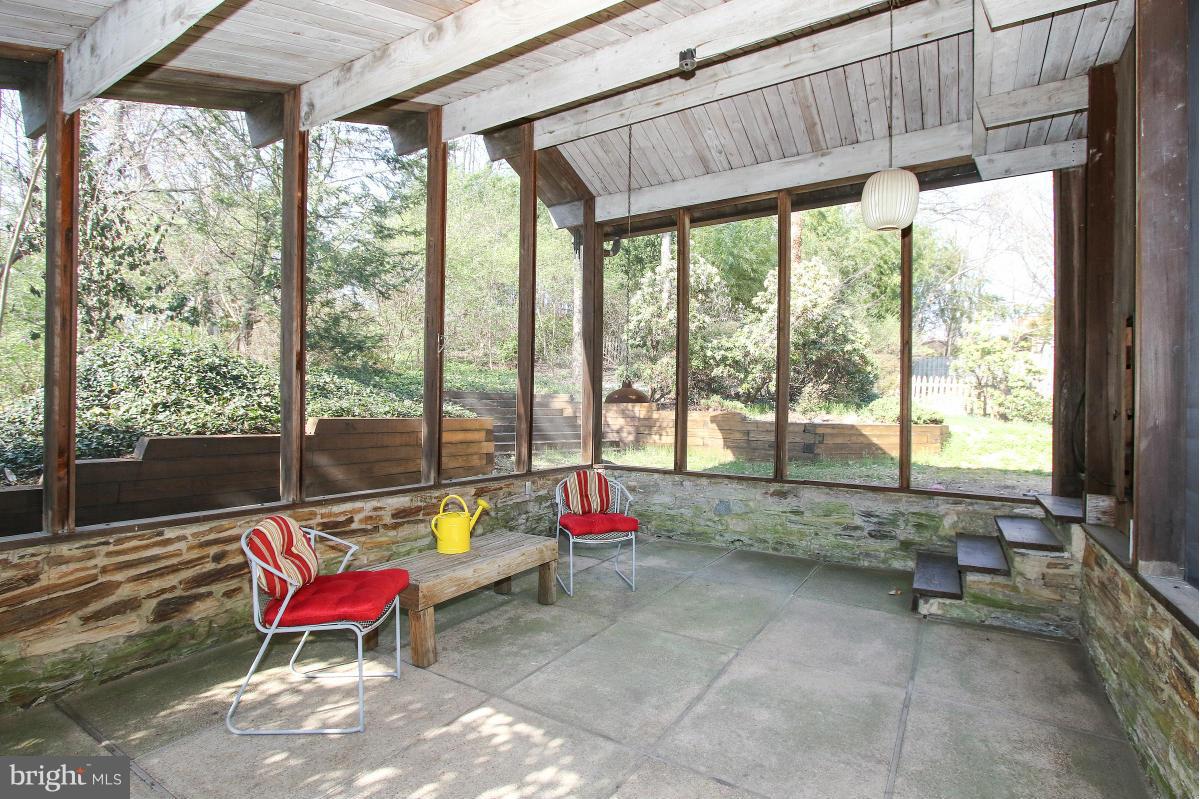 7708 Beech Tree Road Bethesda, MD 20817 - Photo 27 of 30 a living room with furniture and floor to ceiling windows