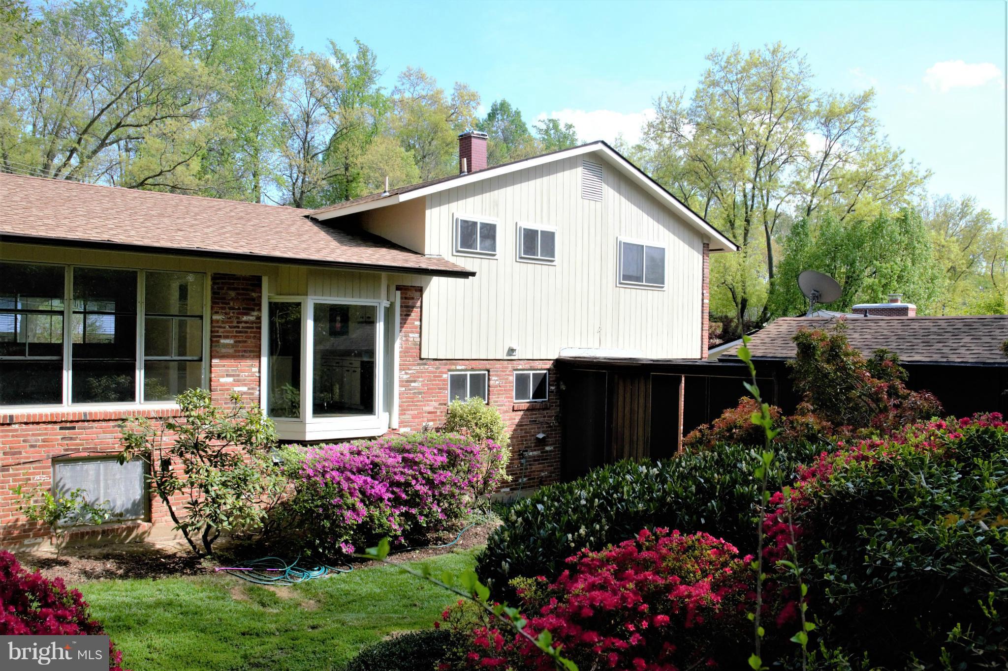 7708 Beech Tree Road Bethesda, MD 20817 - Photo 30 of 30 a view of a house with a yard and garden
