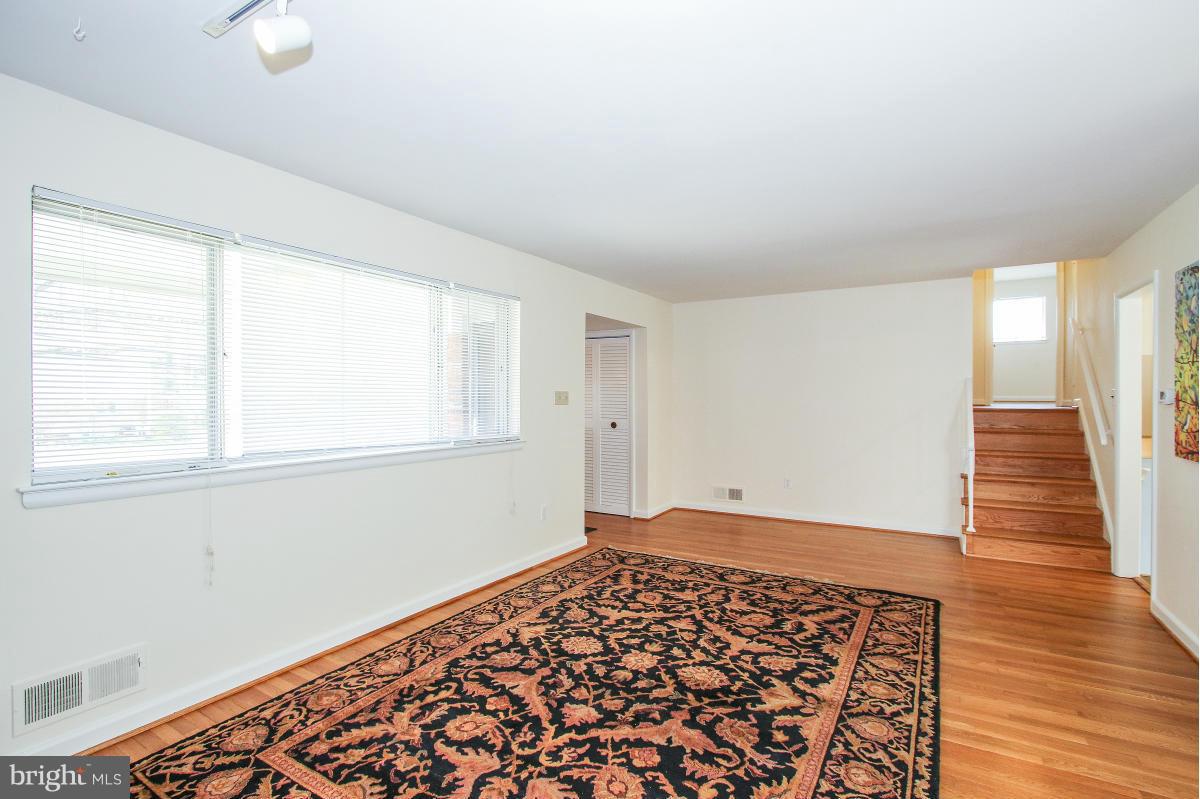 7708 Beech Tree Road Bethesda, MD 20817 - Photo 6 of 30 a view of an empty room and window