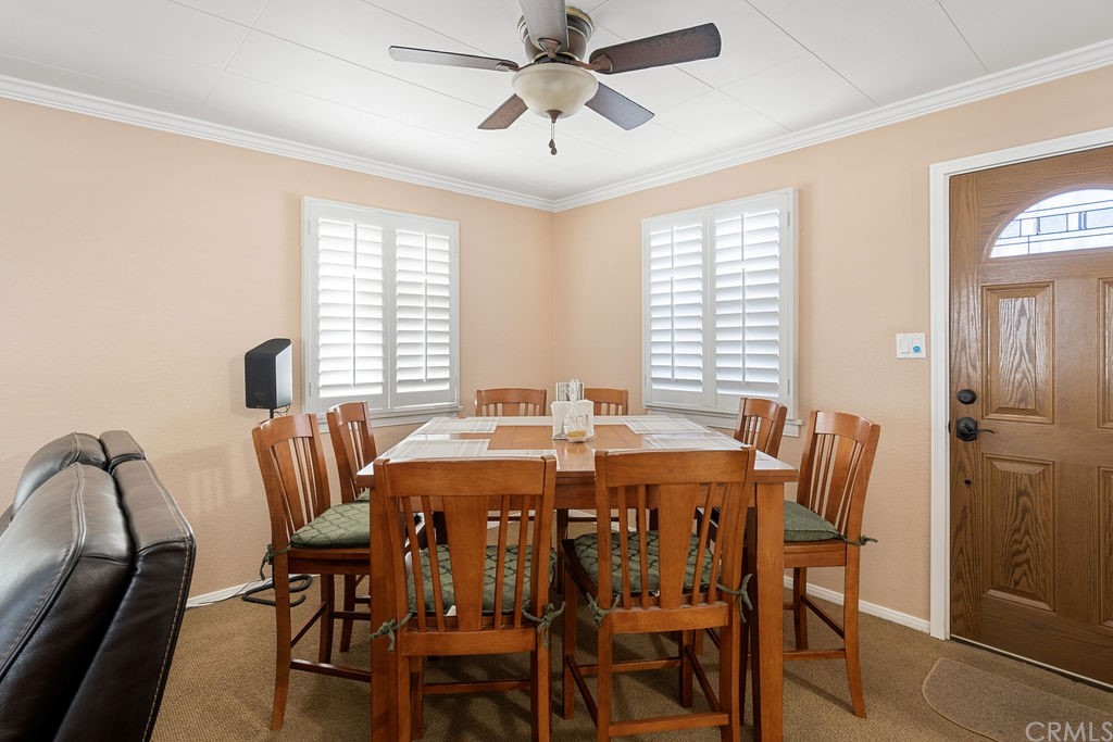 671 Olive Street Upland, CA 91786 - Photo 11 of 47 a view of a dining room with furniture and window