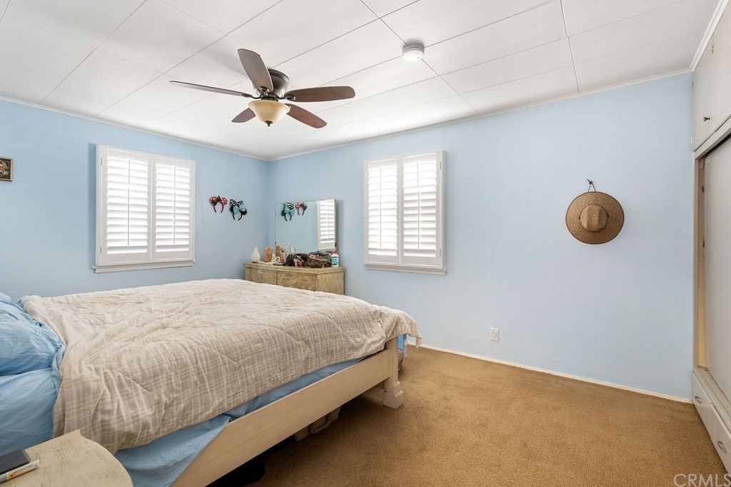 671 Olive Street Upland, CA 91786 - Photo 21 of 47 a bedroom with a bed and window