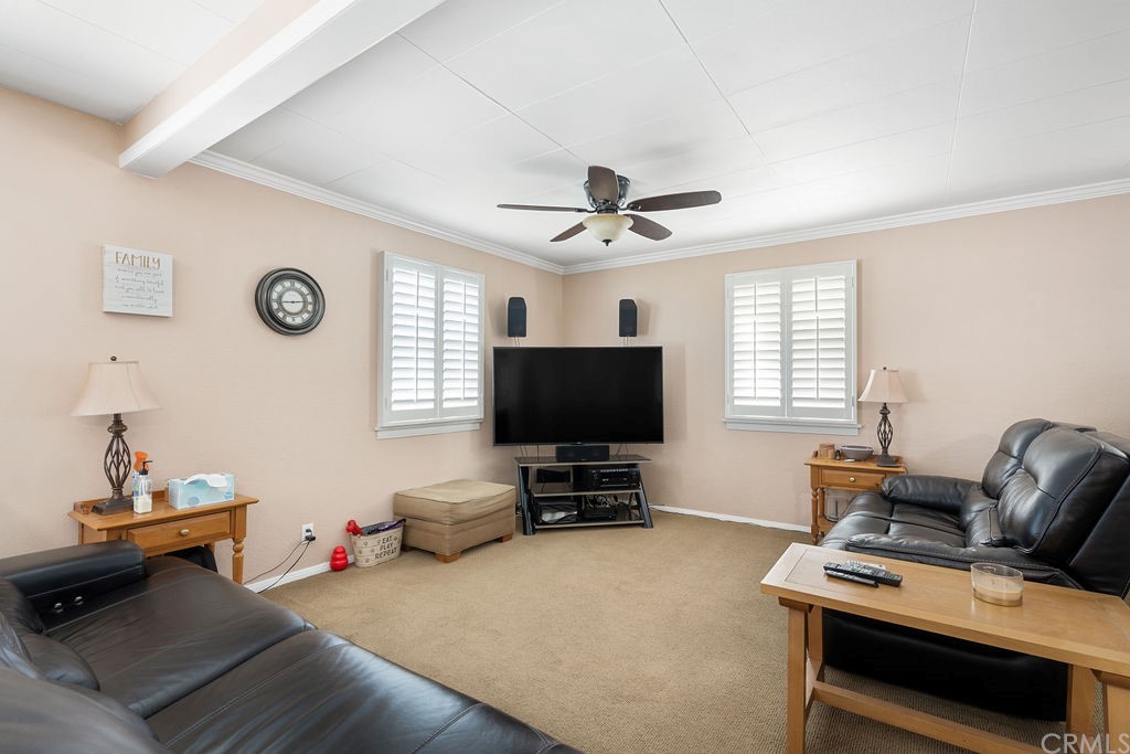 671 Olive Street Upland, CA 91786 - Photo 5 of 47 a living room with furniture and a flat screen tv