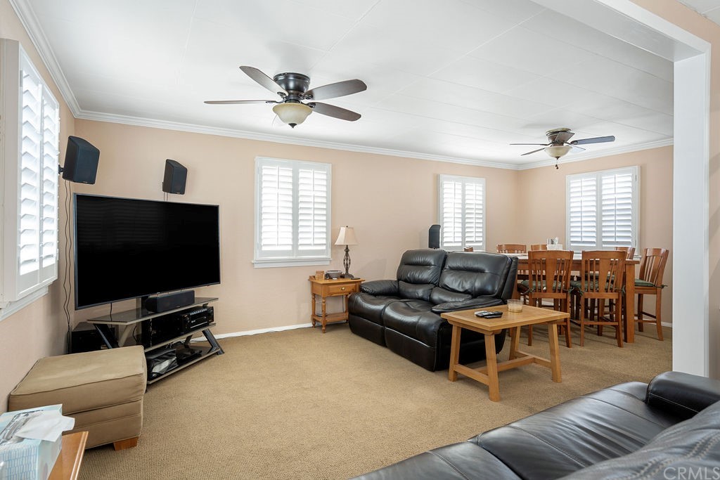 671 Olive Street Upland, CA 91786 - Photo 9 of 47 a living room with furniture and a flat screen tv