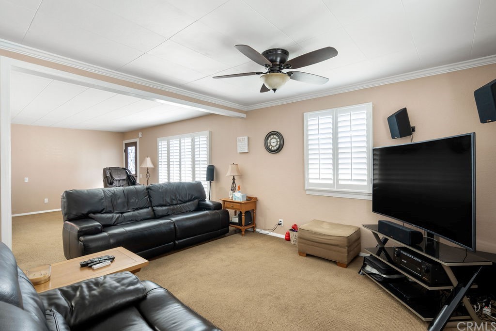 671 Olive Street Upland, CA 91786 - Photo 10 of 47 a living room with furniture and a flat screen tv