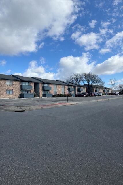 a view of car parked in front of a building