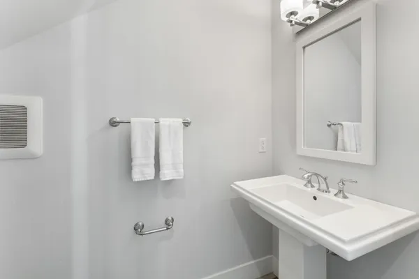 a view of a livingroom with wooden floor and a large window