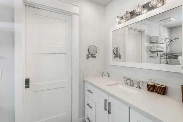 a bathroom with a shower toilet and sink
