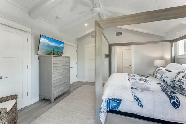 a spacious bathroom with a shower sink and mirror